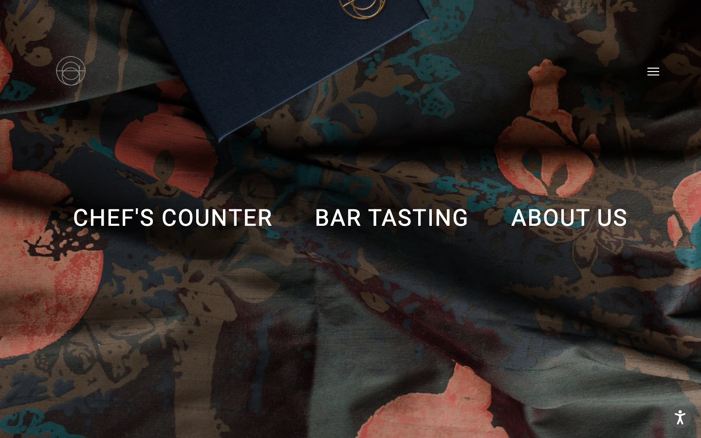 Atomixnyc - The layout is split, with a dark, patterned background contrasting with clean, sans-serif typography. The overall feel is sophisticated and understated, prioritizing visual texture and a sense of curated elegance.  ·  restaurant website, fine dining design, minimalist hospitality, dark mode restaurant, editorial website, split screen layout, luxury restaurant, modern restaurant design, atelier website, restaurant navigation