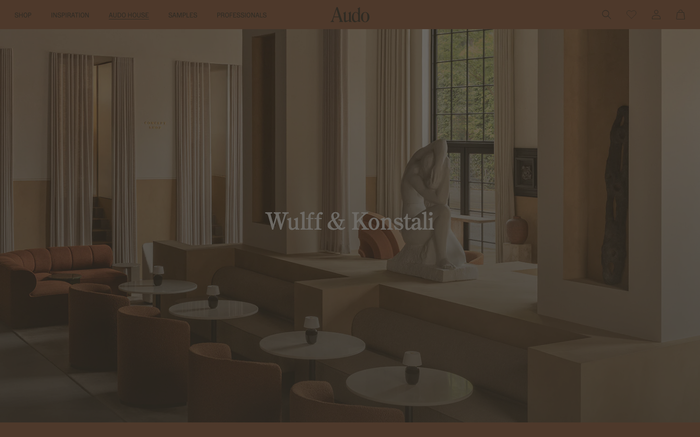 The page uses a full-bleed image to establish a mood, with minimal text overlay. The color palette is muted and earthy, creating a sense of understated elegance. Typography is clean and legible, prioritizing visual impact over extensive information. · minimalist portfolio, soft branding, editorial website, muted color palette, fullbleed image, calm aesthetic, studio website, clean typography, decade retrospective, audocph