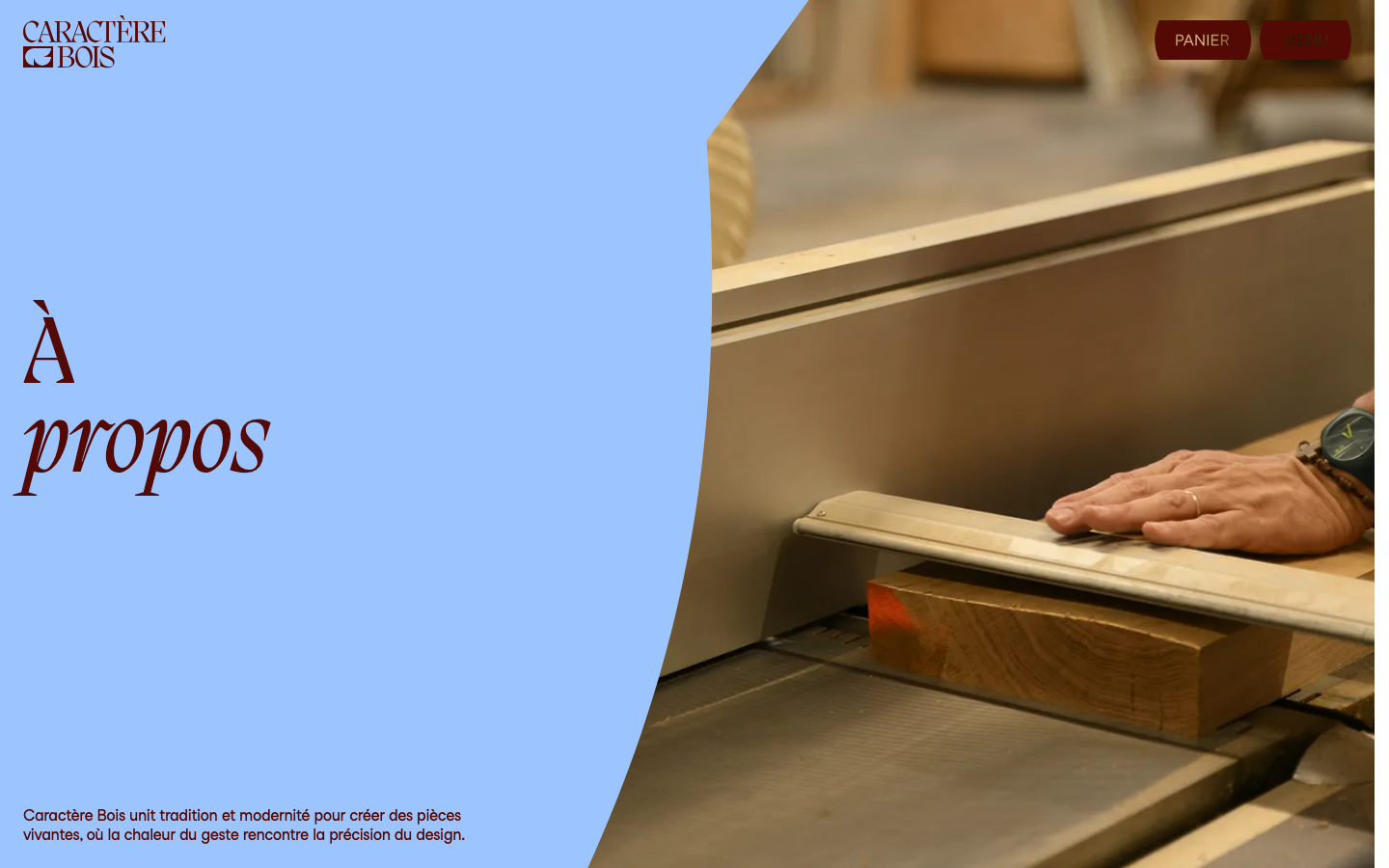 An asymmetric composition featuring a soft blue background that curves into a high-detail photograph of woodworking. The use of a large, italicized serif typeface creates a sophisticated, artisanal mood. · artisanal furniture hero, asymmetric layout, serif typography, woodworking portfolio, editorial luxury web design