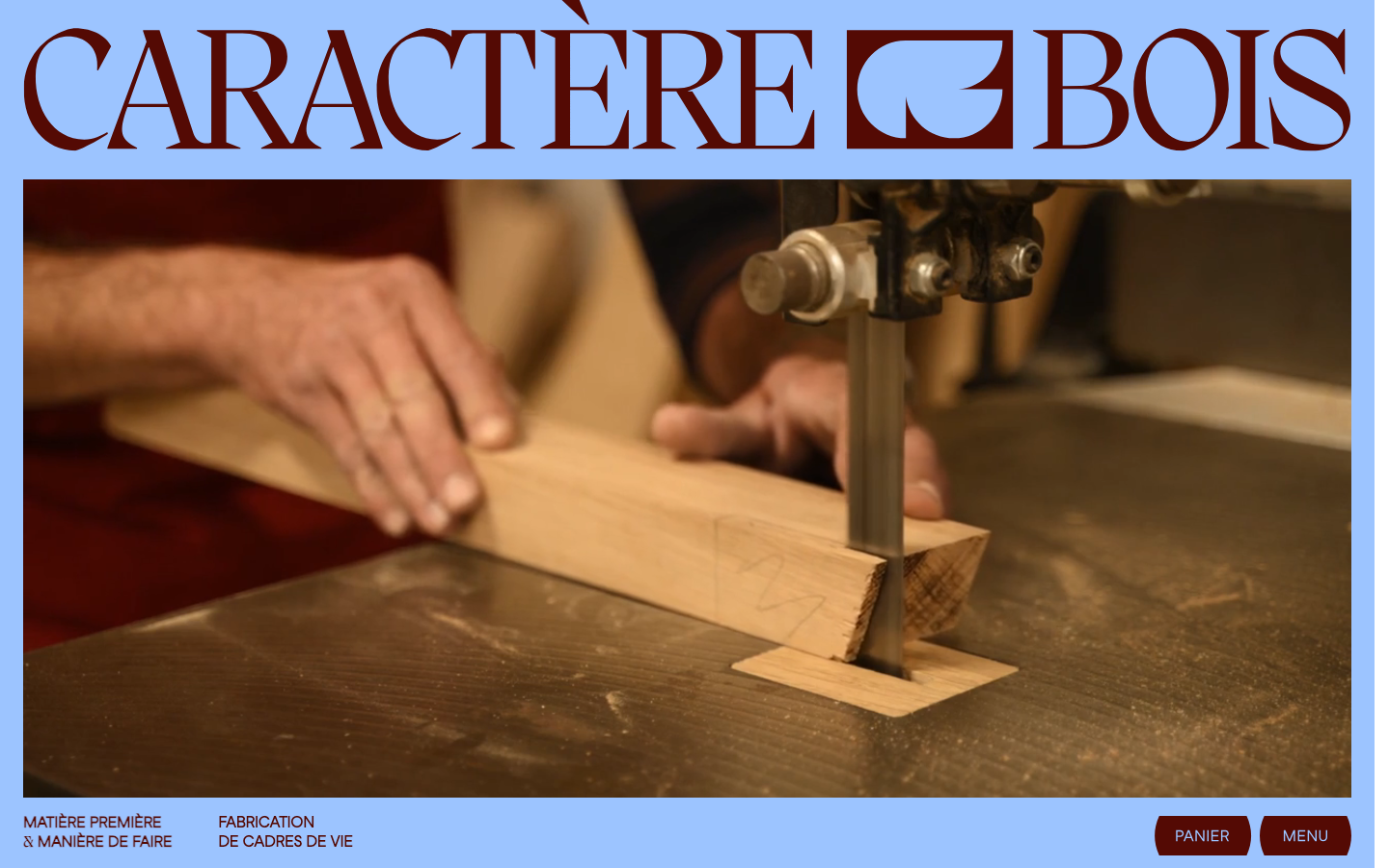 High-contrast layout featuring a massive serif wordmark and a full-bleed action shot of woodworking. The composition uses a stark white background to frame the organic textures of the wood and machinery.  ·  artisan furniture hero, editorial woodworking site, serif typography brand, full-bleed craft photography, minimalist luxury furniture