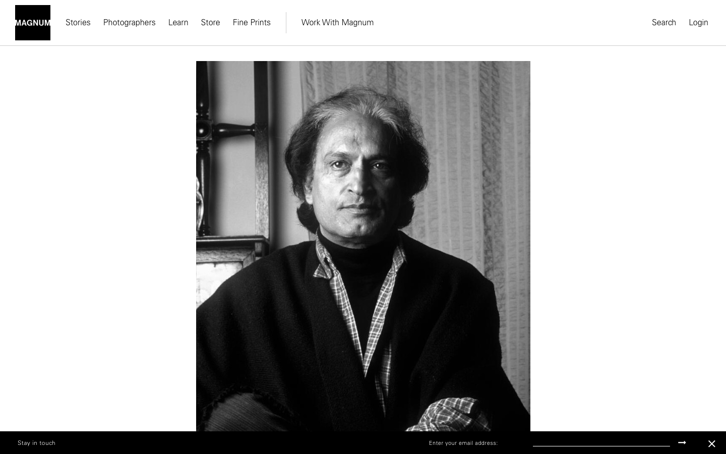 The page prioritizes a single, striking portrait, employing a high-contrast black and white aesthetic. Typography is minimal, allowing the image to dominate. The overall feel is one of quiet authority and timelessness. · black and white portrait, editorial photography, photo agency, minimalist website, portfolio design, monochrome portrait, magnum photos, classic photography