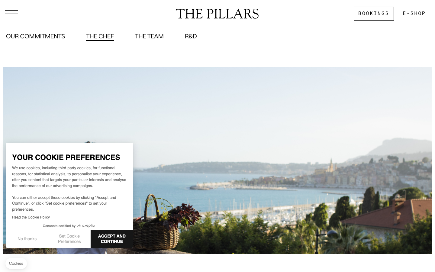 The page uses a split-screen layout, with a large, evocative image on the left and text elements on the right. The typography is elegant and refined, contributing to a sense of understated luxury. The overall density is low, allowing the visual elements to breathe. · luxury restaurant, french cuisine, coastal dining, fine dining, mirazur, hospitality design, elegant website, split screen, minimalist design