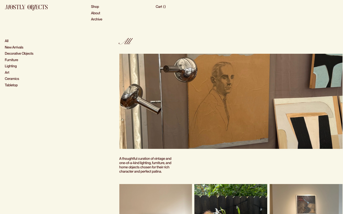 A high-end curation page using an asymmetric layout with a left-aligned category menu and large, airy imagery. The typography relies on a sophisticated serif for the brand and a clean sans-serif for navigation. · vintage furniture shop, editorial ecommerce, minimalist gallery layout, curated home objects, muted earth tones, serif branding