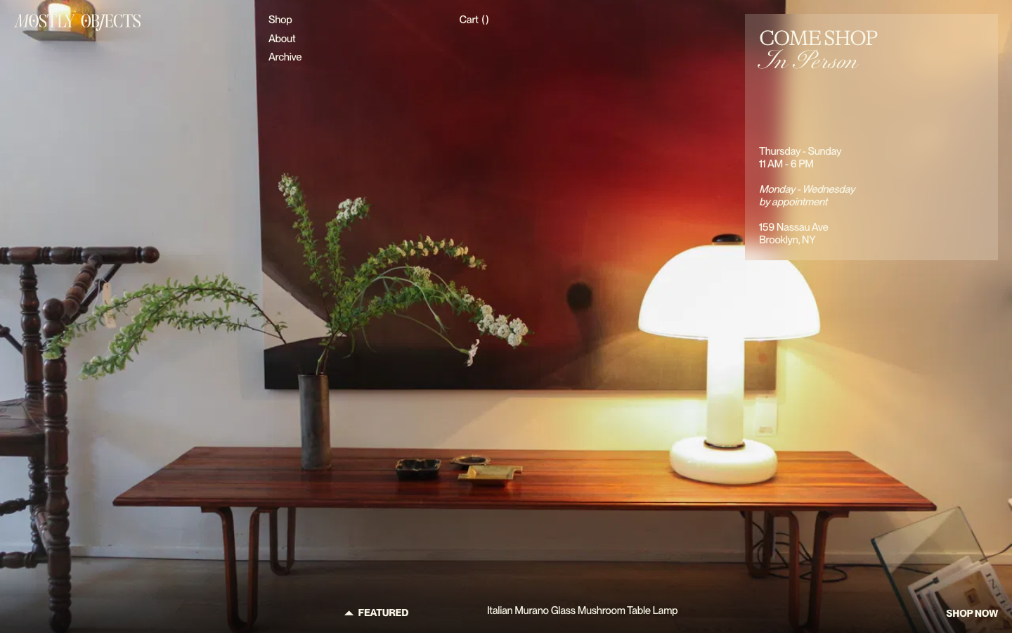 A high-impact photographic layout using a full-bleed image as the primary interface. The typography blends a clean sans-serif with an elegant script for a curated, gallery-like feel.  ·  editorial ecommerce hero, minimalist furniture store, gallery style landing page, luxury interior design web, full bleed image hero